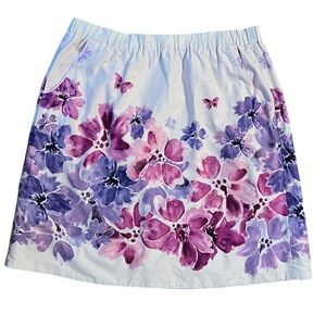 A line skirt from Anthropologie purple with painted flowers, lined, pockets!